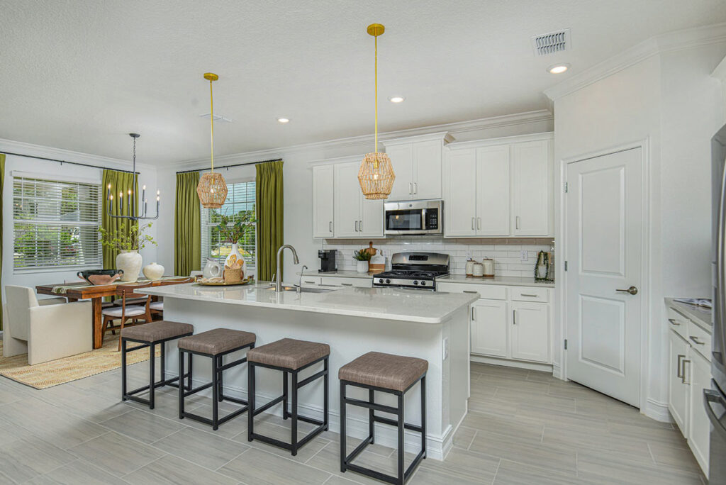 Lennar’s Sunburst model features an airy, open kitchen and expansive dining area, anchored by an oversized island.